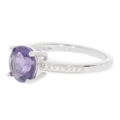 Round purple sapphire sterling silver ring with accent stones, showcasing elegance and luxury.