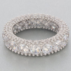 Elegant white moissanite sterling silver ring with sparkling accents, showcasing luxury and brilliance.