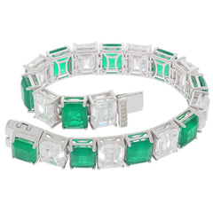 Elegant Green Emerald Sterling Silver Bracelet with Moissanite accents, showcasing a stunning gemstone design.