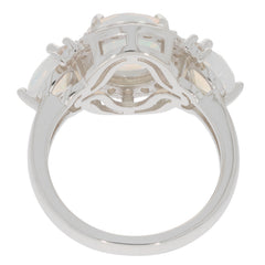 Elegant white opal sterling silver ring with accent stones, showcasing its unique design and craftsmanship from behind.