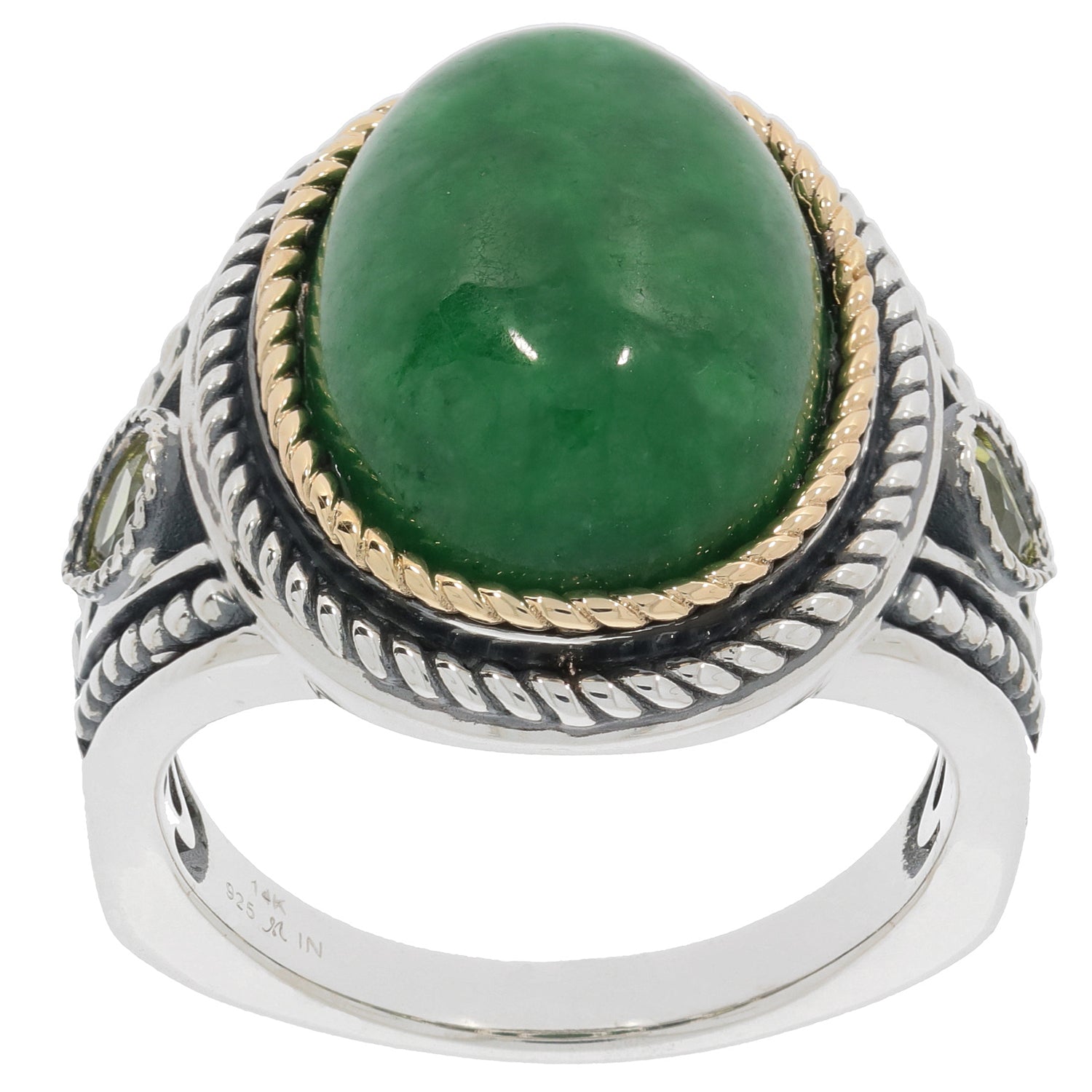 Oval green jadeite sterling silver ring with gold accents showcasing elegance and luxury.