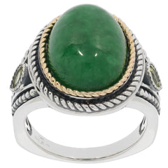 Oval green jadeite sterling silver ring with gold accents showcasing elegance and luxury.