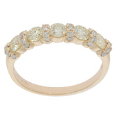 Round light yellow diamond ring set in 14K yellow gold, featuring sparkling accent stones for a luxurious look.