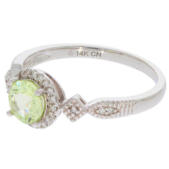 Elegant Green Peridot ring in 14K white gold with diamond accents, showcasing a sparkling round gemstone.