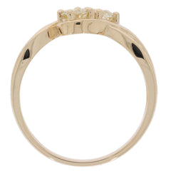 Round green diamond ring in 14K yellow gold, showcasing elegant design and sparkling gemstones.