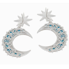 Stylish silver earrings with star and crescent moon design featuring blue accents.