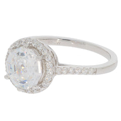 Round white Moissanite ring in sterling silver, featuring a sparkling gemstone and elegant accent stones.