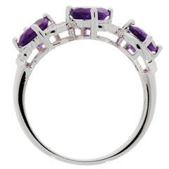 Elegant oval purple amethyst sterling silver ring showcasing sparkling gemstones and a modern design.
