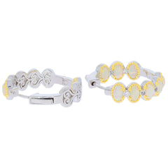 Elegant yellow opal and diamond sterling silver hoop earrings with intricate design, perfect for sophisticated style.