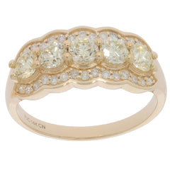 14K yellow gold ring featuring three round diamonds and sparkling accents, perfect for elegant jewelry collections.