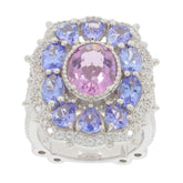Oval pink topaz sterling silver ring surrounded by blue gemstones, showcasing elegance and luxury.