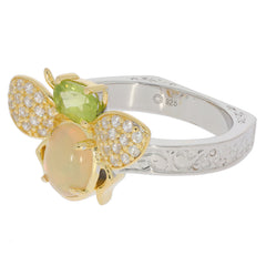 Elegant bee-inspired ring featuring green peridot and sparkling gemstones in sterling silver, perfect for unique jewelry collections.
