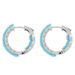 Round blue turquoise sterling silver earrings with sparkling accents, showcasing elegant craftsmanship.