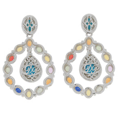 Elegant Pear Blue Turquoise and multi-colored sterling silver earrings with sapphire accents, radiating luxury and style.