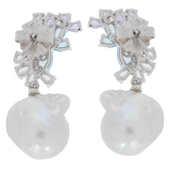 Elegant white pearl sterling silver earrings with intricate design and sparkling gemstone accents.