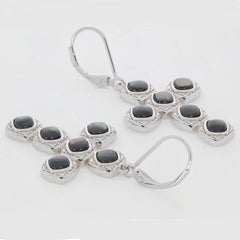 Sterling silver earrings featuring cushion-cut blue shell gemstones in an elegant design.