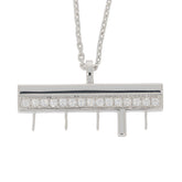 Elegant white diamond sterling silver pendant on a delicate chain, showcasing sparkling gemstones.