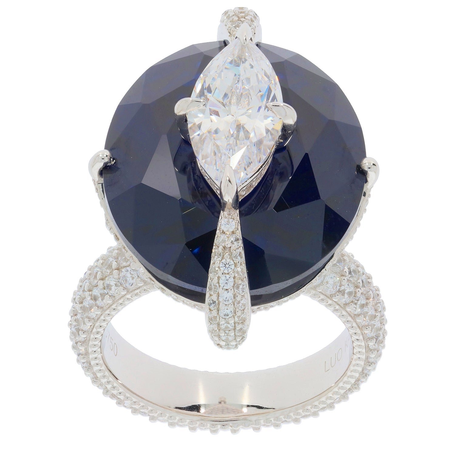 Elegant oval blue sapphire ring with sparkling diamond accent, set in sterling silver for a luxurious look.