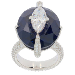 Elegant oval blue sapphire ring with sparkling diamond accent, set in sterling silver for a luxurious look.