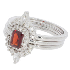 Emerald Red Garnet sterling silver ring featuring a stunning gemstone and accent diamonds in a luxurious design.