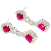 Cushion red ruby sterling silver earrings with accent gemstones, perfect for elegant and luxurious style.