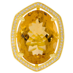 Stunning oval yellow citrine gemstone surrounded by sparkling accents in a luxurious gold setting.