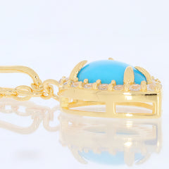Close-up of a Blue Turquoise pendant in gold setting with gemstones, showcasing elegance and luxury in jewelry design.