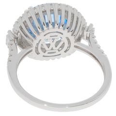 Sterling silver ring featuring a round blue topaz gemstone from the back, showcasing intricate design details.