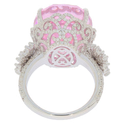 Elegant oval pink sapphire sterling silver ring, featuring intricate design and sparkling accents, showcasing luxury and beauty.