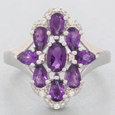 Elegant sterling silver ring featuring oval and pear-shaped purple amethyst gemstones, ideal for luxurious style.
