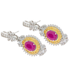 Elegant oval red ruby sterling silver earrings with moissanite accents and yellow detailing.