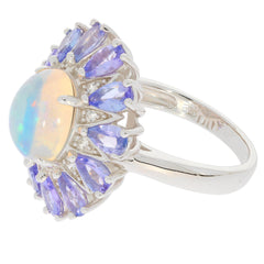 Blue opal sterling silver ring with violet accents, showcasing a sparkling gemstone and elegant design.