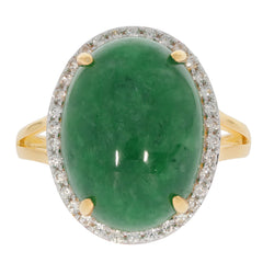 Oval green jadeite sterling silver ring with sparkling gemstone accents, a luxurious fashion accessory.