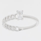 Emerald White Moissanite Sterling Silver Ring with accent, featuring a radiant gemstone and elegant chain design.