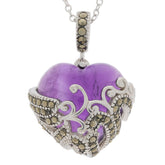 Heart-shaped purple amethyst pendant in sterling silver setting with intricate design and accents.