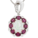 Oval white opal sterling silver pendant surrounded by deep red gemstones, showcasing an elegant style for any occasion.