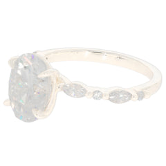 Elegant Marquise White Moissanite ring in 14K yellow gold with accent stones, showcasing luxury and brilliance.