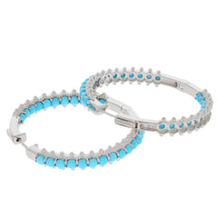 Stylish turquoise bracelets with silver accents and sparkling stones for a luxurious look.