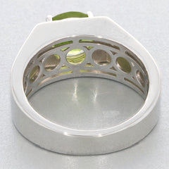 Elegant round green peridot sterling silver ring showcasing intricate band design and gemstone brilliance.