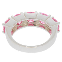 Round pink sapphire sterling silver ring with multiple gemstones showcasing elegance and luxury.