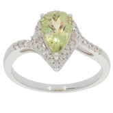 Elegant Green Peridot teardrop ring in 14K white gold with diamond accents, showcasing luxury and sophistication.