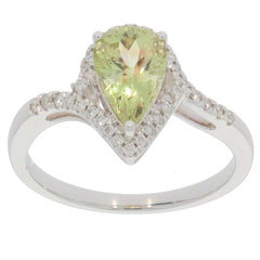 Elegant Green Peridot teardrop ring in 14K white gold with diamond accents, showcasing luxury and sophistication.