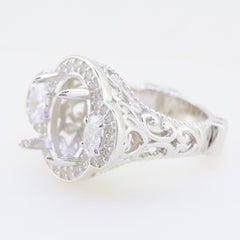 Sterling silver ring with intricate design, featuring a setting for an accent stone, elegant and luxurious craftsmanship.