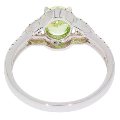 Green Peridot 14K white gold ring showcasing a sparkling gemstone and elegant design.