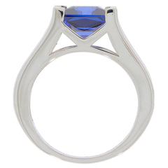 Princess blue sapphire sterling silver ring showcasing a stunning cut gemstone and elegant design.
