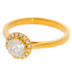 Round white diamond ring in 22K yellow gold, featuring a halo of smaller diamonds for a luxurious shine.