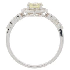 Elegant Green Peridot ring in 14K white gold featuring diamond accents, showcased from the side angle.