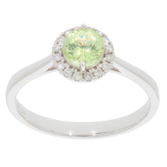Green Peridot Sterling Silver Ring with Moissanite accents, showcasing a round cut gemstone in an elegant design.