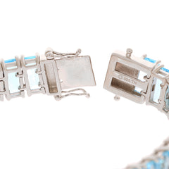 Close-up of an Emerald Blue Topaz sterling silver bracelet clasp showing exquisite detailing and gemstone brilliance.