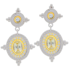 Elegant yellow gemstone earrings with intricate silver design, perfect for adding luxury and style to any outfit.